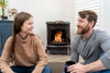 HP75C Cast Pellet Stove With People Enjoying the Warmth